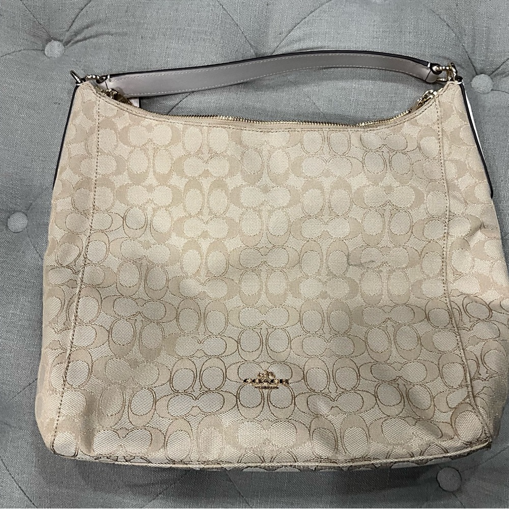 Cream colored Coach bag carried twice